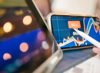 Multi-market trader reviewing Bitcoin, Ethereum, and forex options